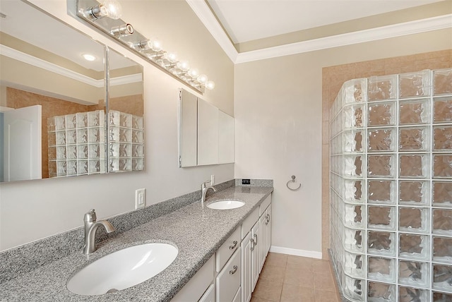 bathroom featuring ornamental molding, a sink, and double vanity