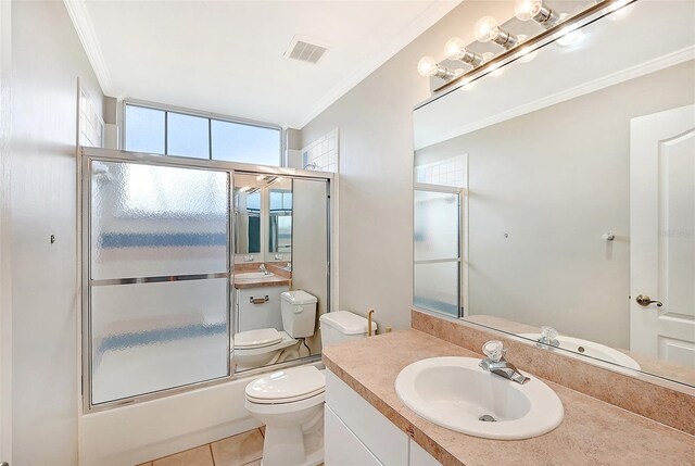 full bathroom featuring enclosed tub / shower combo, toilet, tile patterned flooring, vanity, and ornamental molding