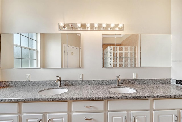 bathroom with double vanity and a sink