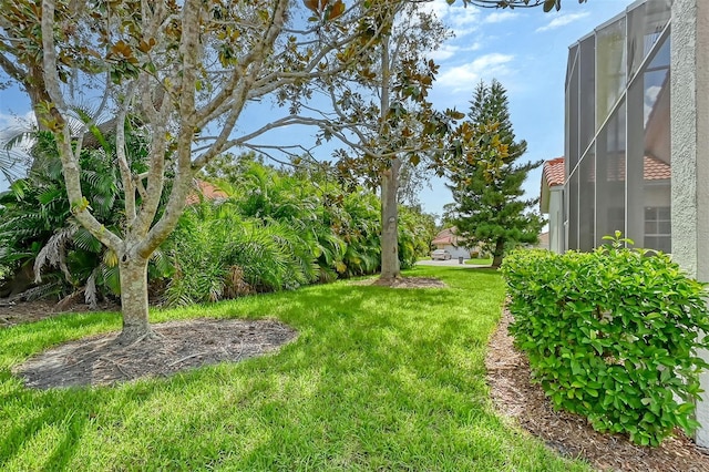 view of yard featuring a lanai