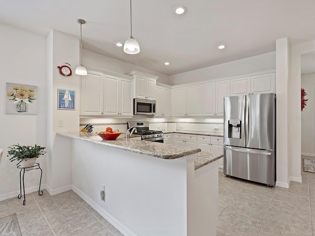 kitchen featuring kitchen peninsula, light tile patterned floors, light stone counters, and stainless steel appliances