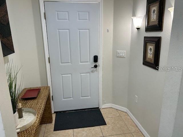 doorway featuring light tile patterned floors