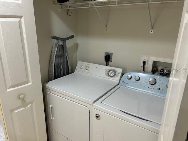 laundry room with washer and dryer