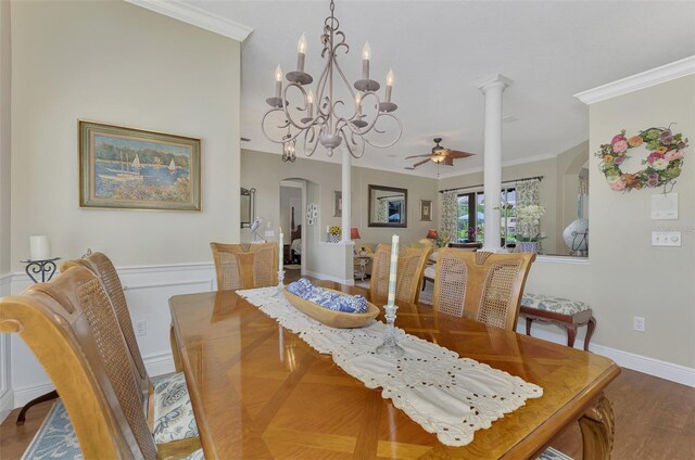 dining area with crown molding, ceiling fan with notable chandelier, and hardwood / wood-style floors