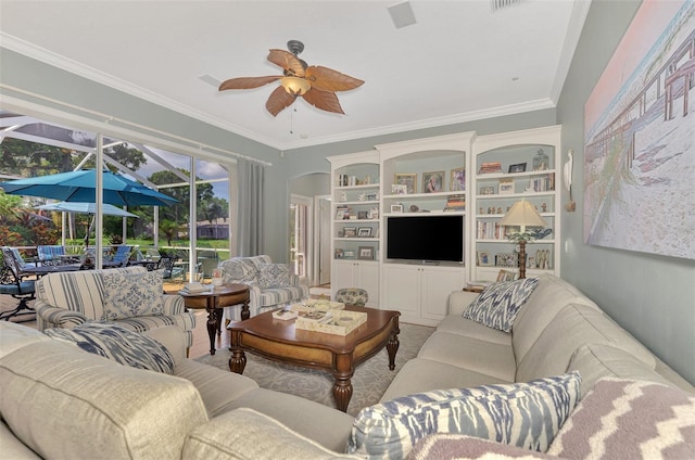 living room featuring ceiling fan and ornamental molding