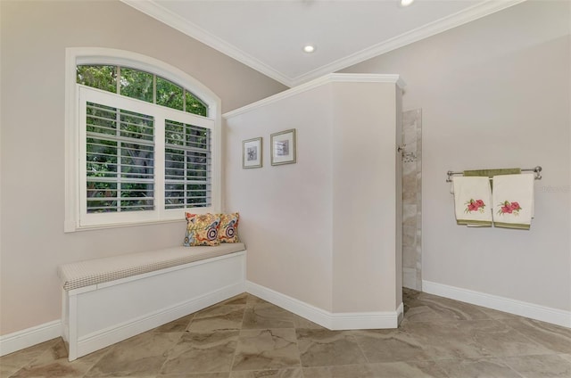 hallway featuring ornamental molding and light tile patterned floors