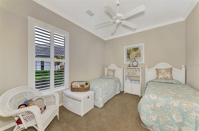 bedroom with ceiling fan, carpet, and crown molding