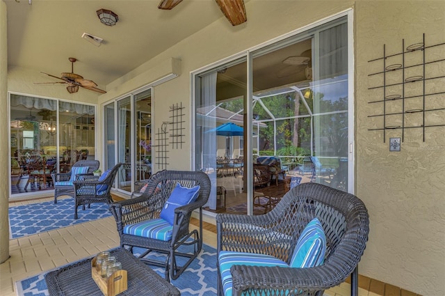 exterior space featuring ceiling fan and an outdoor living space