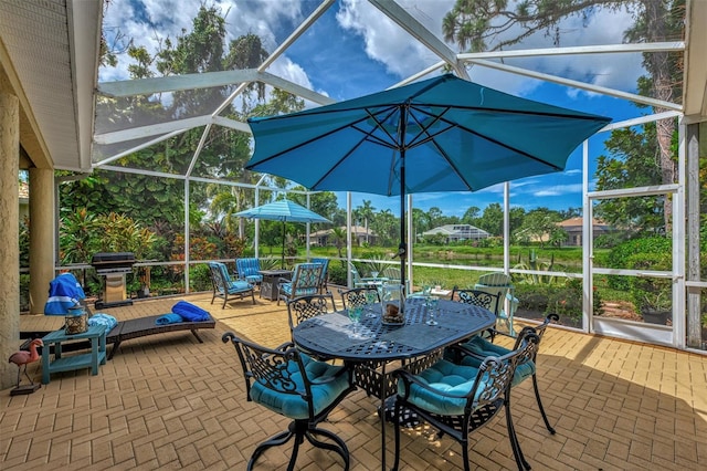 view of patio / terrace with glass enclosure and area for grilling