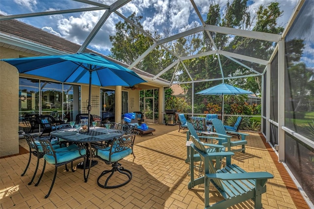 view of patio featuring a lanai