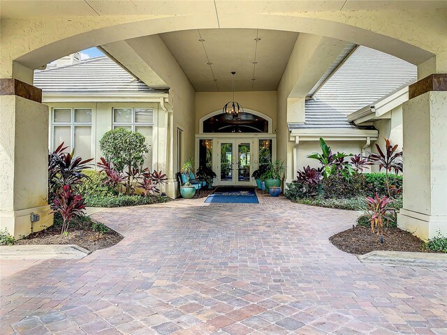 view of exterior entry featuring french doors