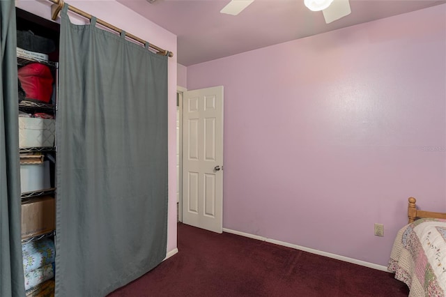 bedroom with dark carpet and ceiling fan