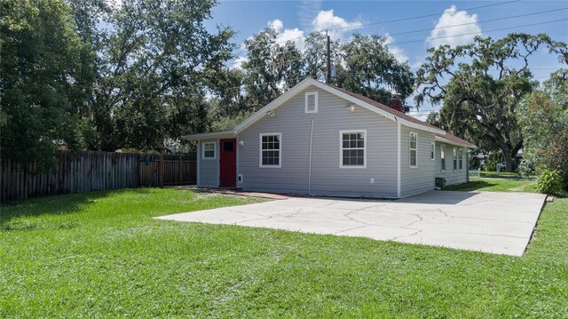 exterior space featuring a lawn and a patio