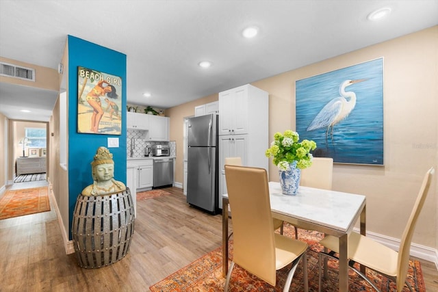 dining area featuring light hardwood / wood-style flooring