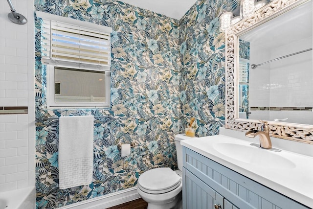 full bathroom with tiled shower / bath combo, toilet, and vanity