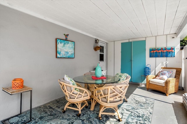 dining area featuring concrete floors