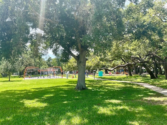 view of property's community featuring a yard