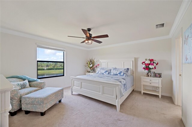 bedroom with light colored carpet, ceiling fan, and ornamental molding