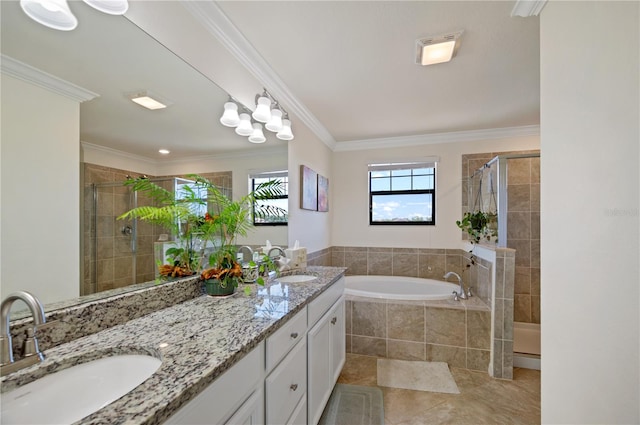 bathroom with tile patterned flooring, crown molding, vanity, and shower with separate bathtub