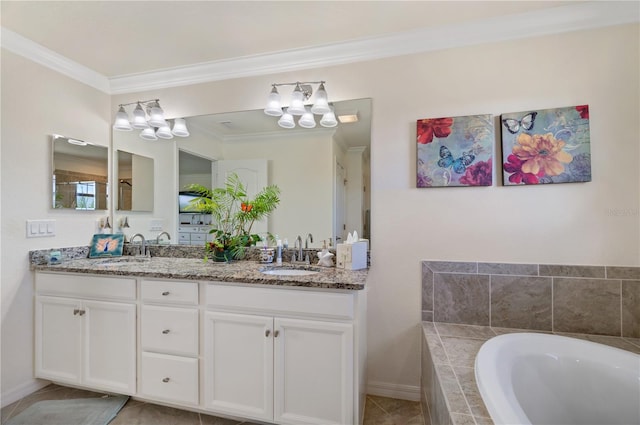 bathroom featuring tiled bath, tile patterned floors, ornamental molding, and vanity