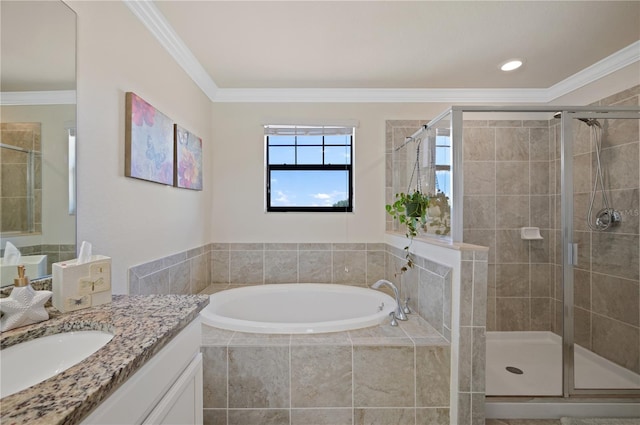 bathroom with plus walk in shower, crown molding, and vanity