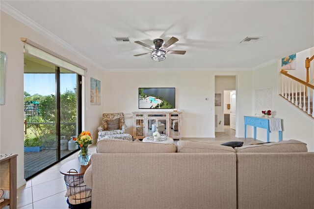 living room with ceiling fan, light tile patterned flooring, and ornamental molding