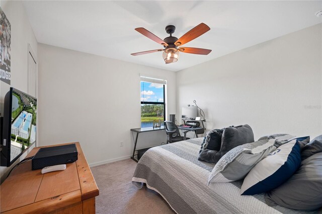 carpeted bedroom with ceiling fan