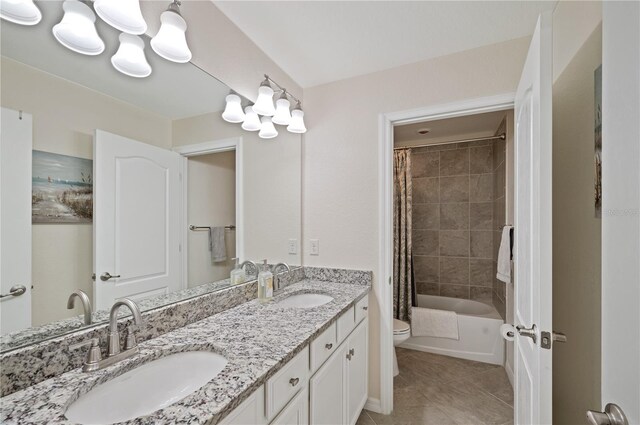 full bathroom featuring toilet, vanity, shower / tub combo, and tile patterned floors