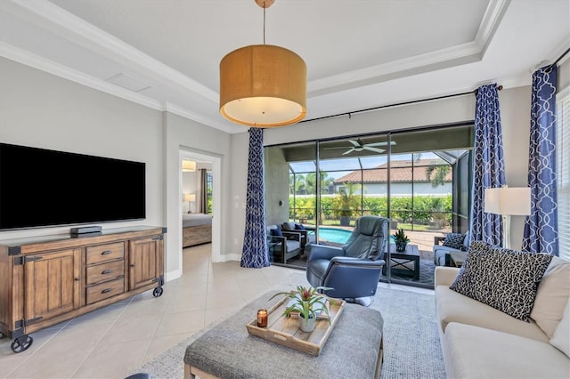 tiled living room with a raised ceiling and crown molding