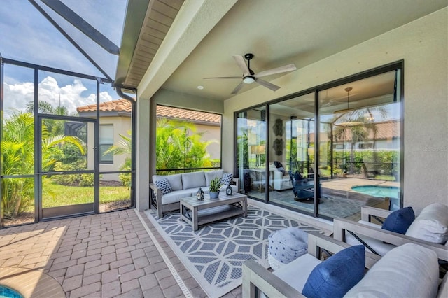 sunroom / solarium featuring ceiling fan