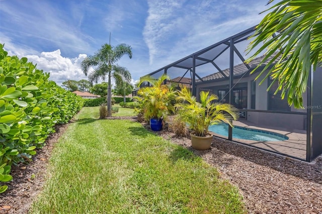 view of yard featuring glass enclosure