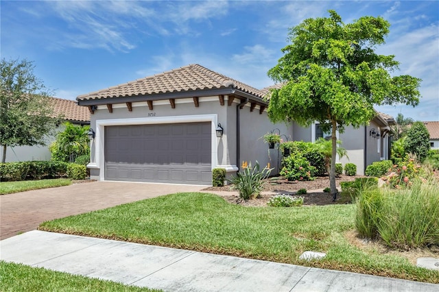 5732 Puccini St, Nokomis, FL 34275 - mediterranean / spanish home with a tile roof, driveway, stucco siding, an attached garage, and a front lawn