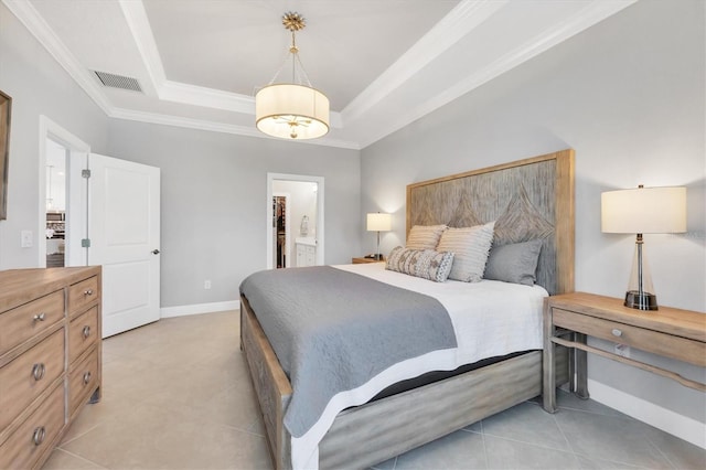 bedroom with ornamental molding and a tray ceiling