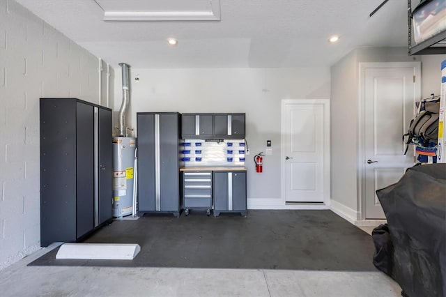 5732 Puccini St, Nokomis, FL 34275 - garage featuring gas water heater and recessed lighting