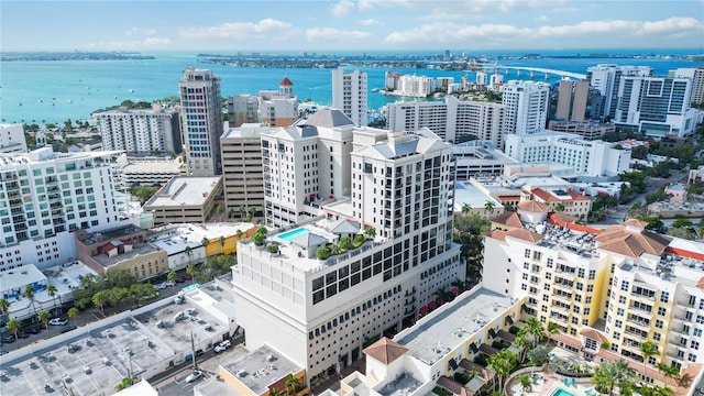 aerial view featuring a water view and a view of city