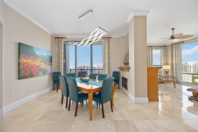 dining area featuring light tile patterned floors, ornamental molding, and ceiling fan