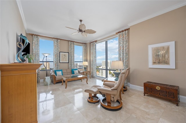 sitting room with ceiling fan, ornamental molding, and light tile patterned floors