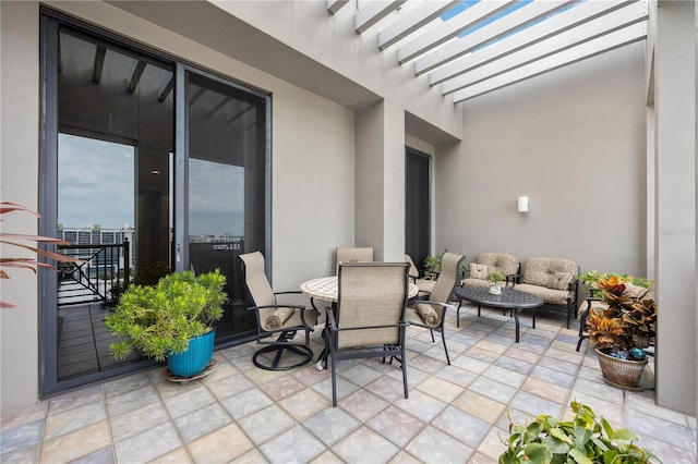 view of patio with outdoor lounge area and a pergola