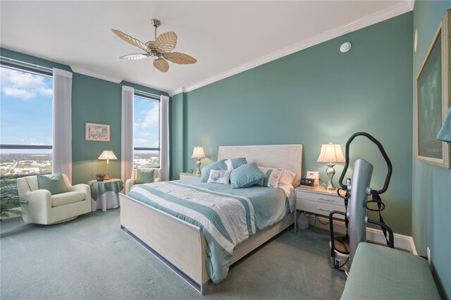 bedroom with ceiling fan, carpet floors, crown molding, and multiple windows