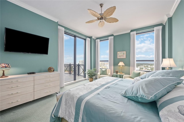 bedroom featuring access to outside, light colored carpet, crown molding, and multiple windows