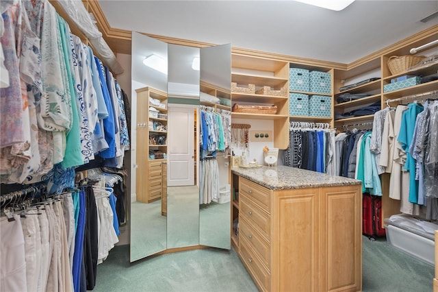 spacious closet with light colored carpet and visible vents