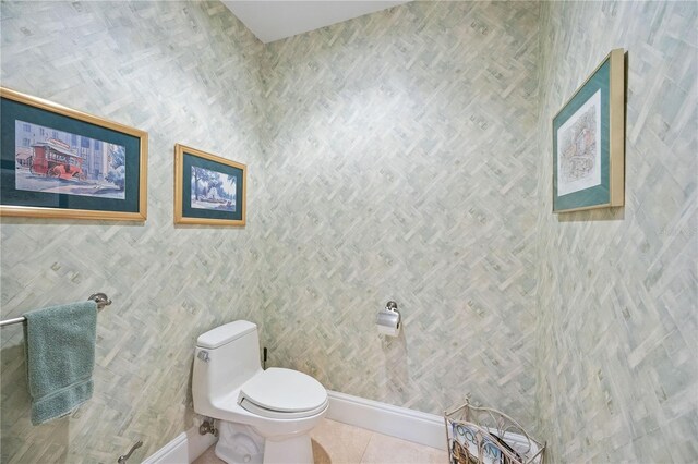 bathroom featuring toilet and tile patterned floors