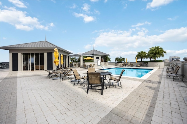 pool with a patio area