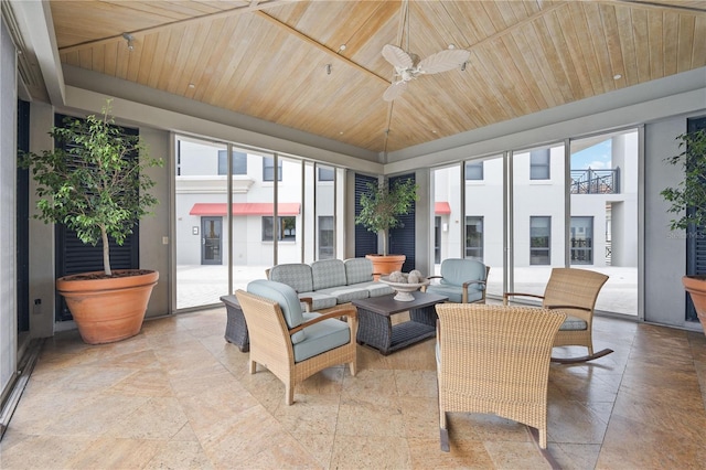 sunroom / solarium featuring ceiling fan, wood ceiling, and a healthy amount of sunlight