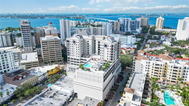 drone / aerial view with a view of city and a water view