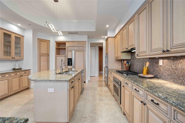 50 Central Ave Unit 17Phb, Sarasota, FL 34236 - kitchen featuring a raised ceiling, tasteful backsplash, under cabinet range hood, stainless steel gas stovetop, and light stone countertops