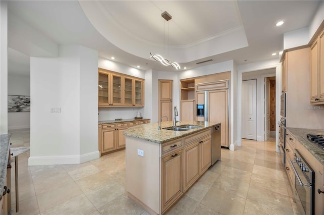 50 Central Ave Unit 17Phb, Sarasota, FL 34236 - kitchen with stainless steel appliances, recessed lighting, light stone countertops, a kitchen island with sink, and glass insert cabinets