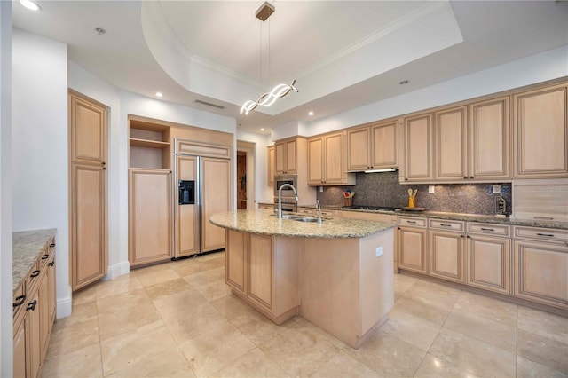 50 Central Ave Unit 17Phb, Sarasota, FL 34236 - kitchen with paneled built in fridge, tasteful backsplash, light stone countertops, open shelves, and a center island with sink