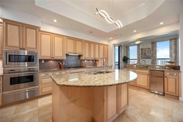 50 Central Ave Unit 17Phb, Sarasota, FL 34236 - kitchen featuring stainless steel appliances, a warming drawer, backsplash, light stone countertops, and crown molding