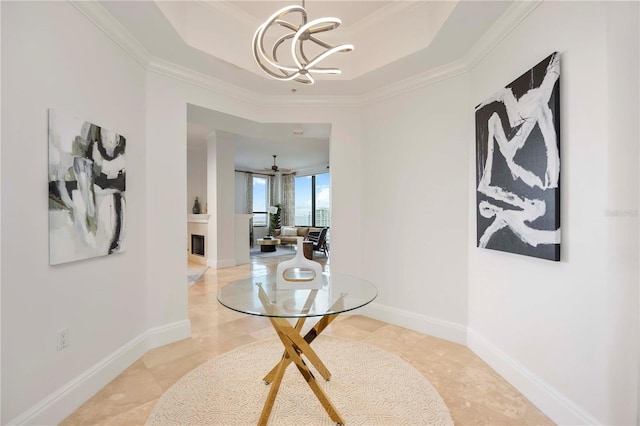 50 Central Ave Unit 17Phb, Sarasota, FL 34236 - hallway featuring a chandelier, ornamental molding, a raised ceiling, and light tile patterned floors
